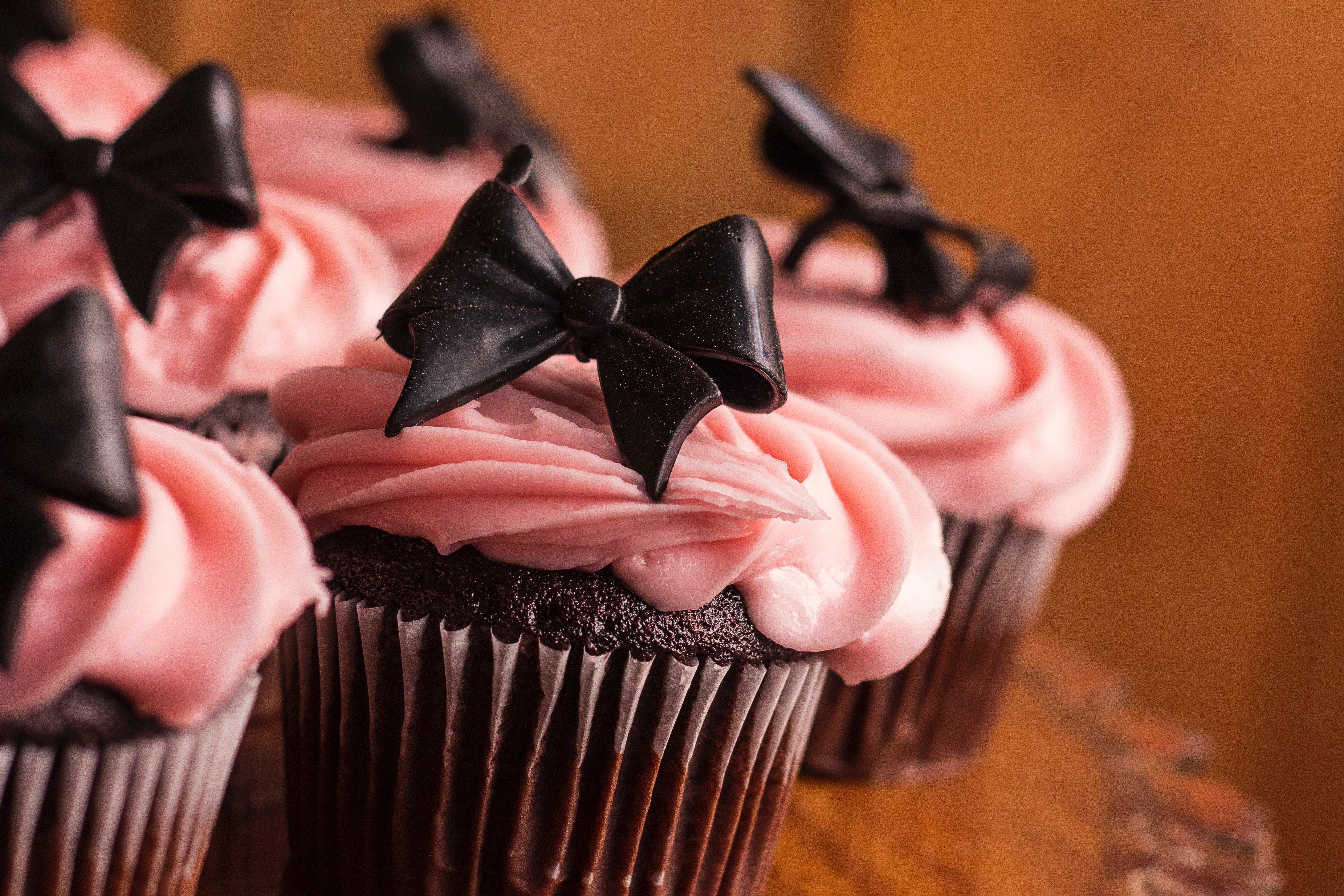 Chocolate cupcake with strawberry cream topping image